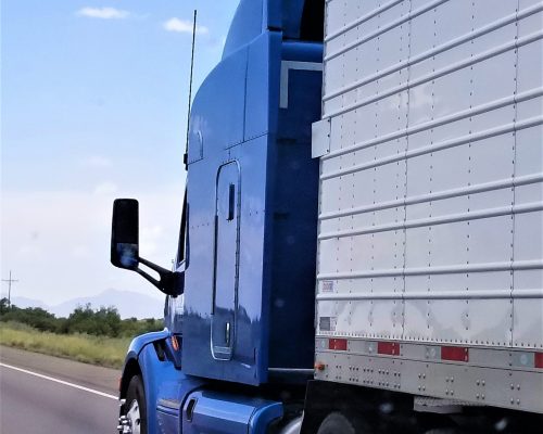 blue-semi-truck-on-the-open-road-during-the-day-2026-03-24-11-34-21-utc